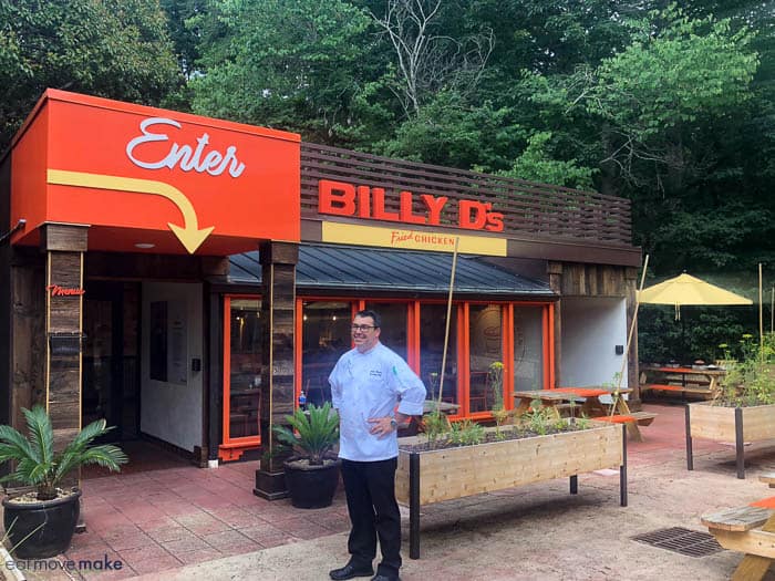 A man standing in front of Billy D\'s restaurant