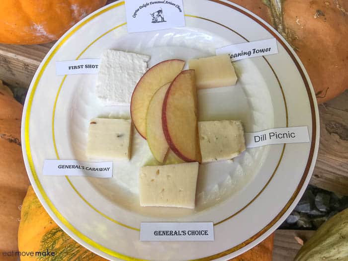 a plate of cheese and apples