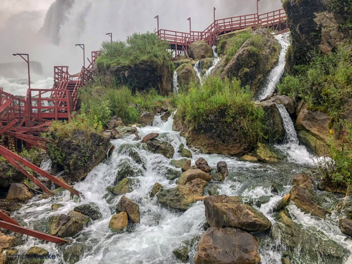 A large waterfall over some water