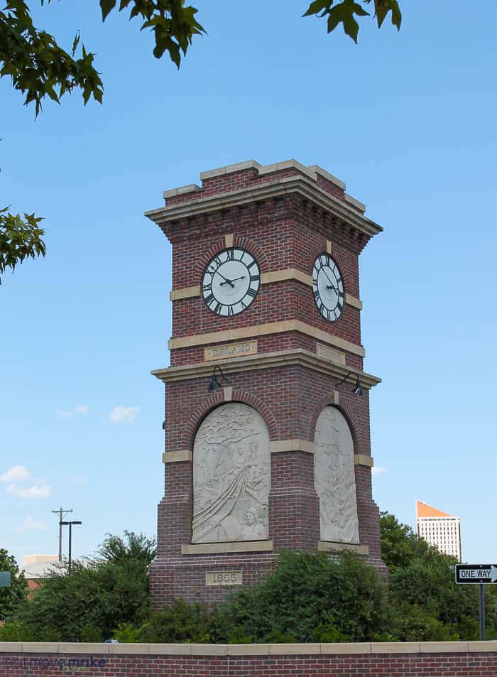 A large tall tower with a clock at the top of a building
