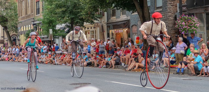 A group of people riding bikes on a city street