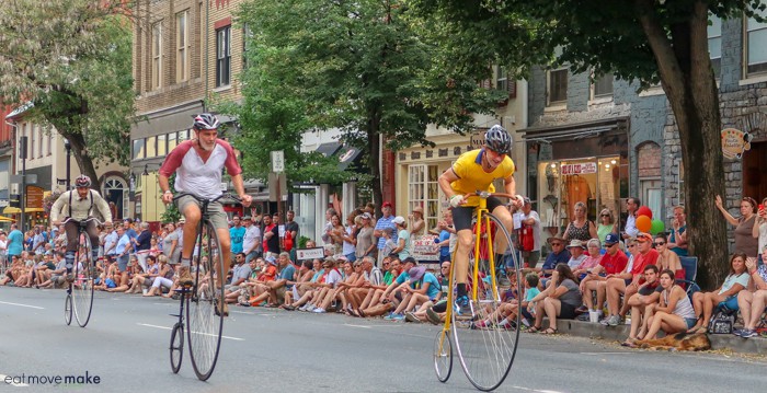 A group of people riding on the back of a bicycle