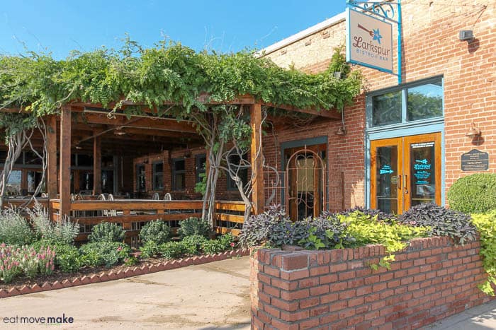 A garden in front of a brick building