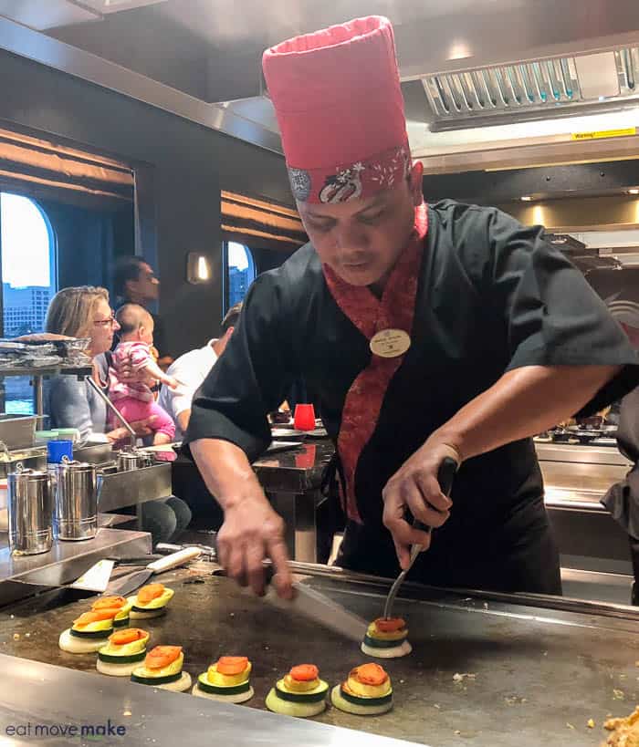 A person cooking in a kitchen at Teppanyaki