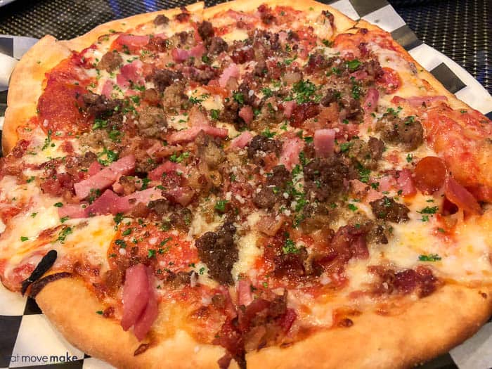 A pizza sitting on top of a table