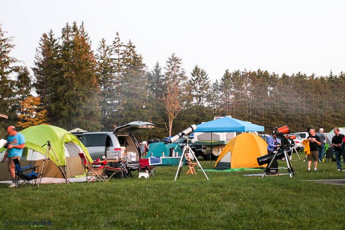 A group of tents sitting on top of a grass covered field