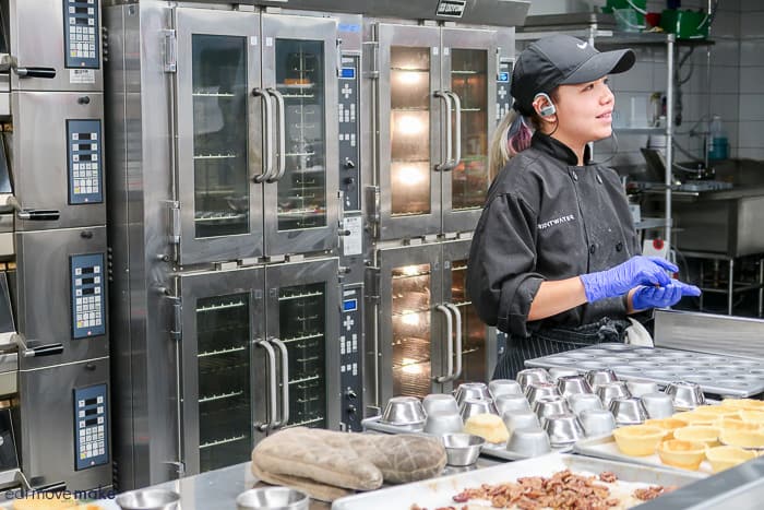 A person preparing food in a kitchen