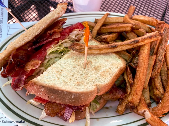 BLT sandwich on plate with fries