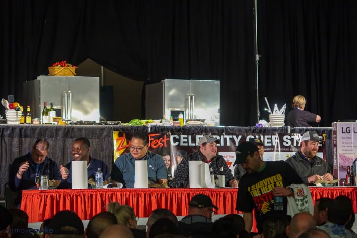 A group of people in a hot wings contest