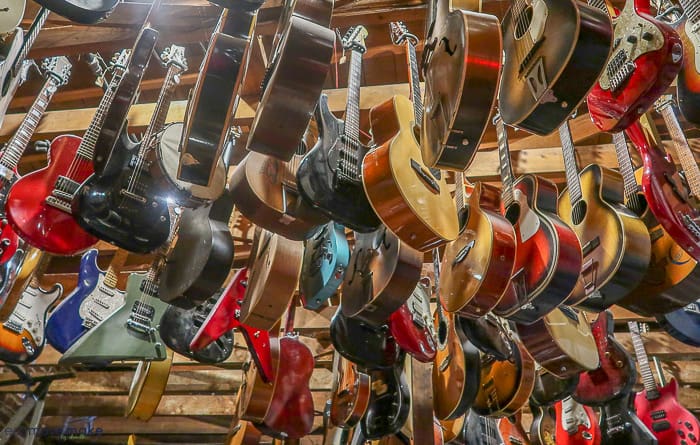 guitars hanging from ceiling