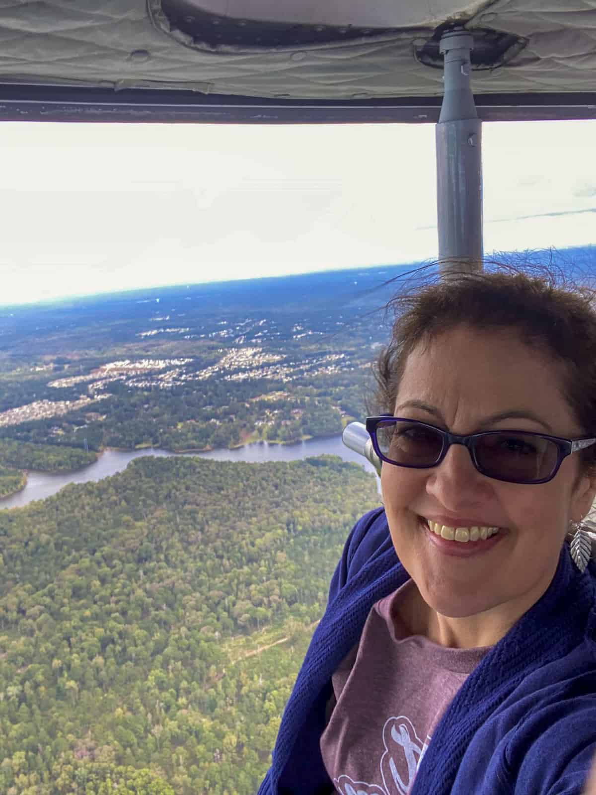 lady taking selfie on helicopter