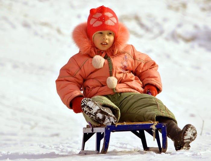 A person sitting on a sled