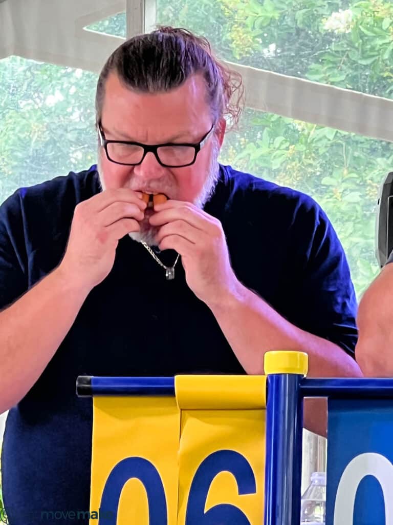 man eating hot dogs