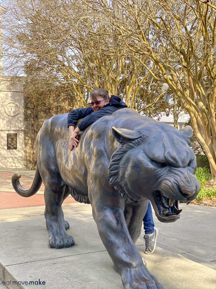 me climbing LSU Mike the Tiger statue