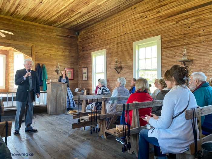 A group of people sitting in old church at Frogmore Plantation