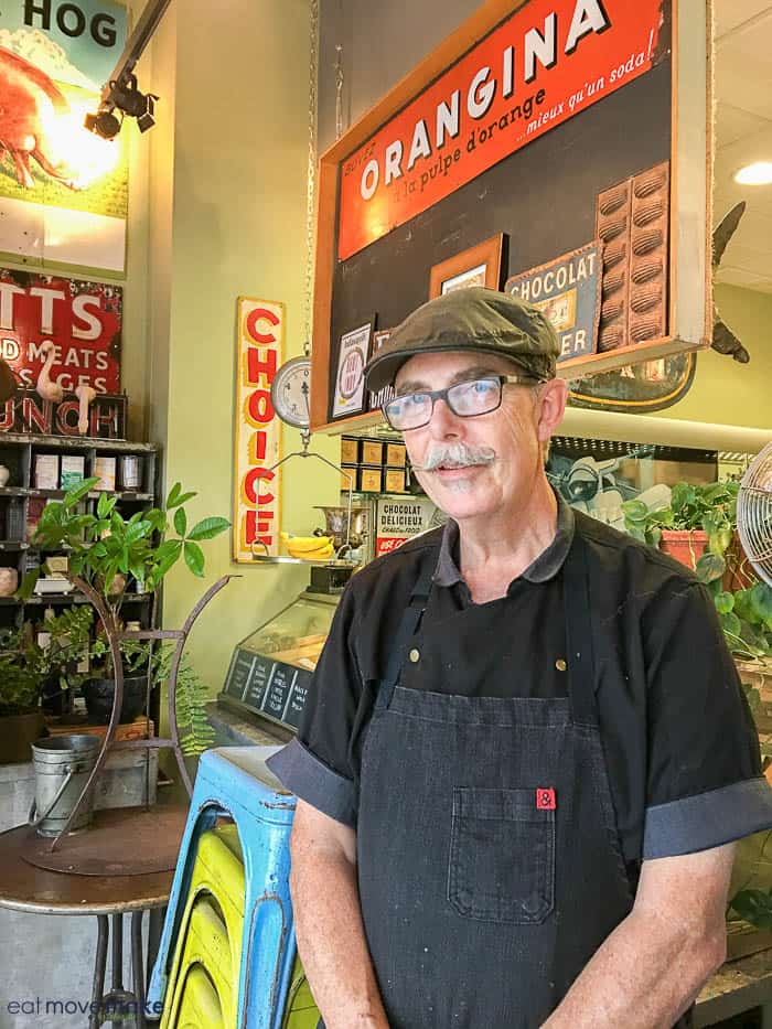 A man standing in front of a store 