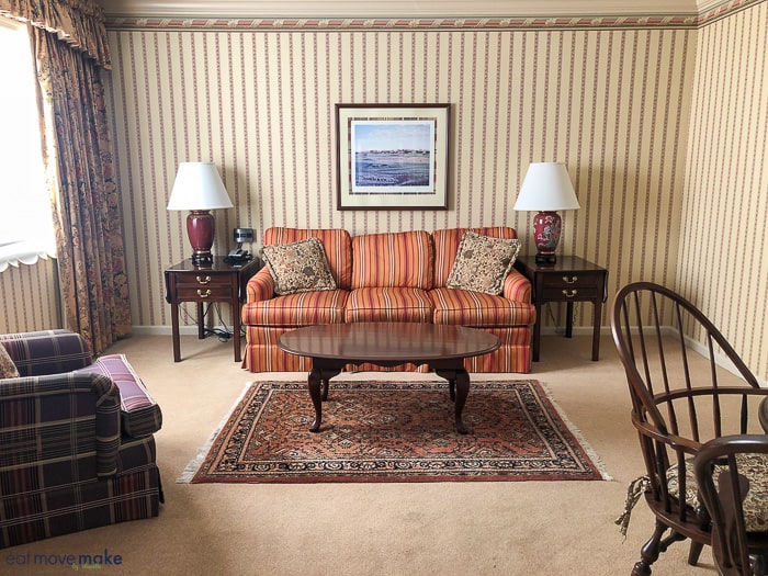 A living room filled with furniture and a large window