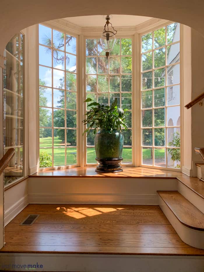 A view of a living room filled with furniture and a large window