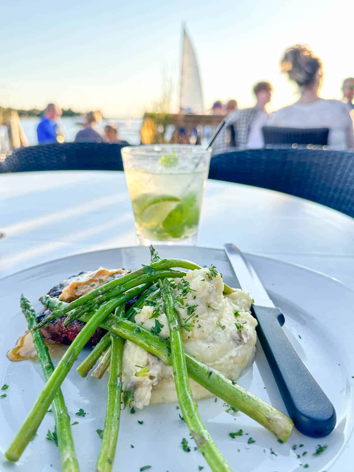 filet and asparagus on white plate