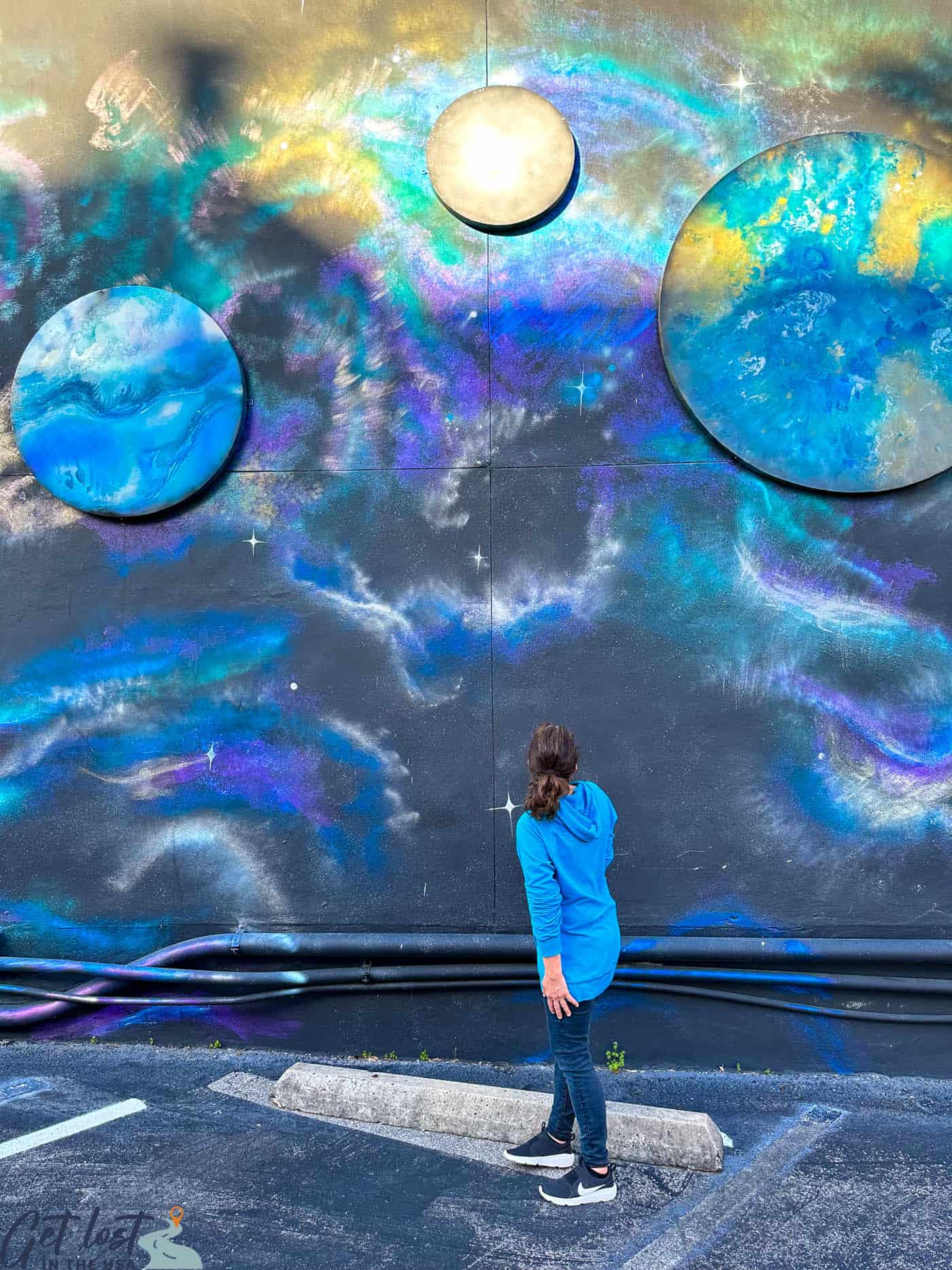 me looking up at space mural