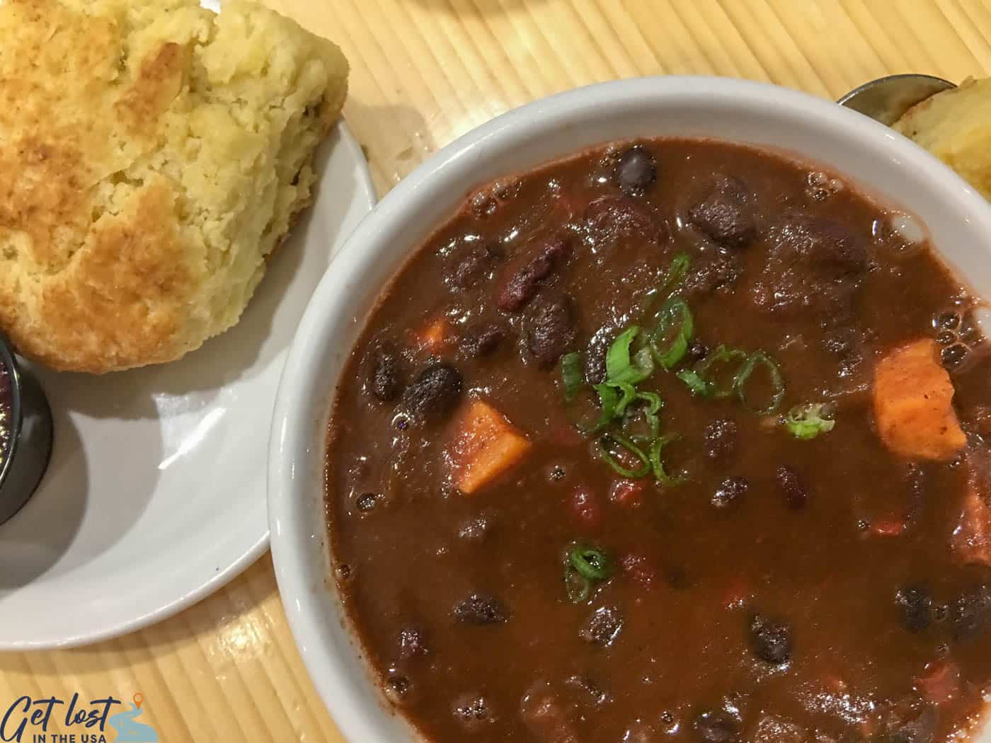 Vegetarian chili and a rosemary biscuit with homemade raspberry jam