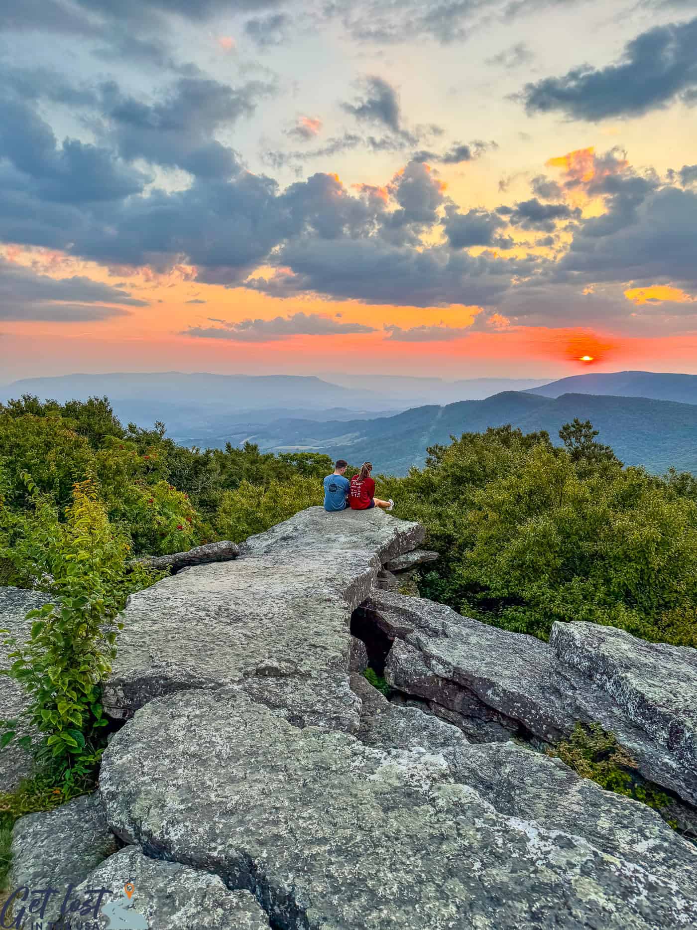 couple watching sunset at Bald Knob Overlook.