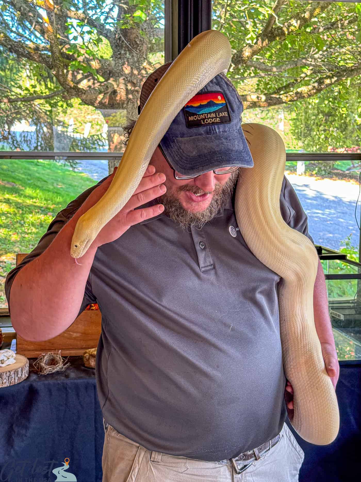 man with snake on head.