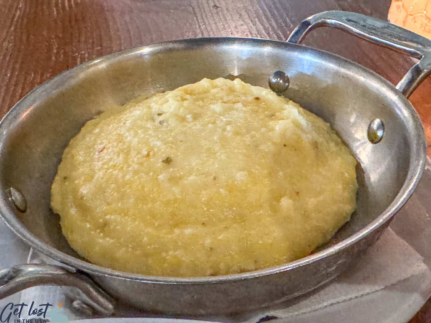 grits in silver serving dish.