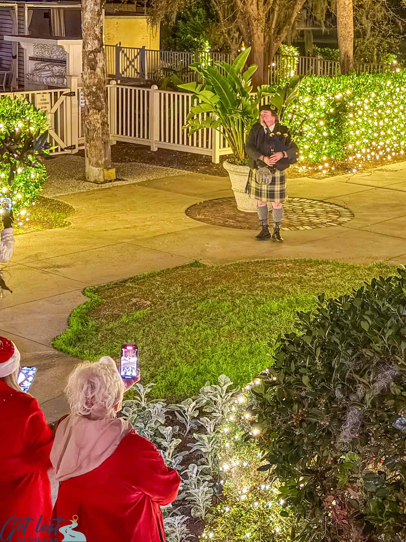 Christmas bagpiper on lawn of Riverfront Veranda at Jekyll Island Club Resort.