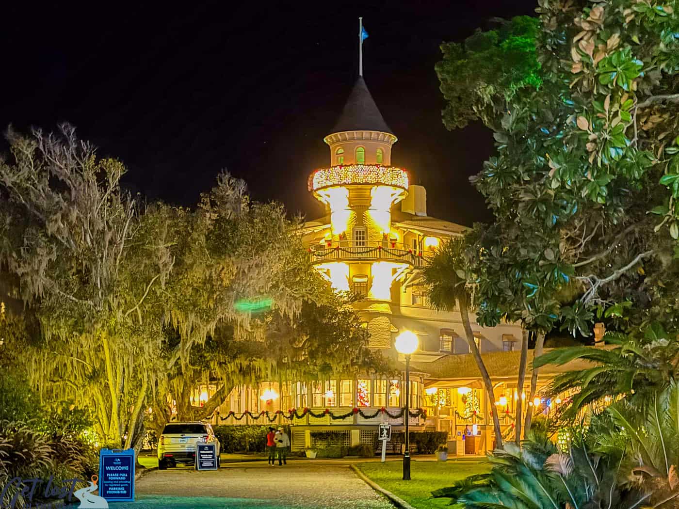 Jekyll Island Club Resort lit at night for holidays.