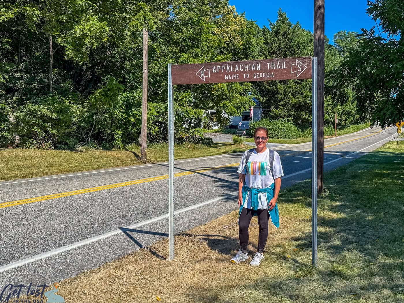 lady by Appalachian Trail sign.