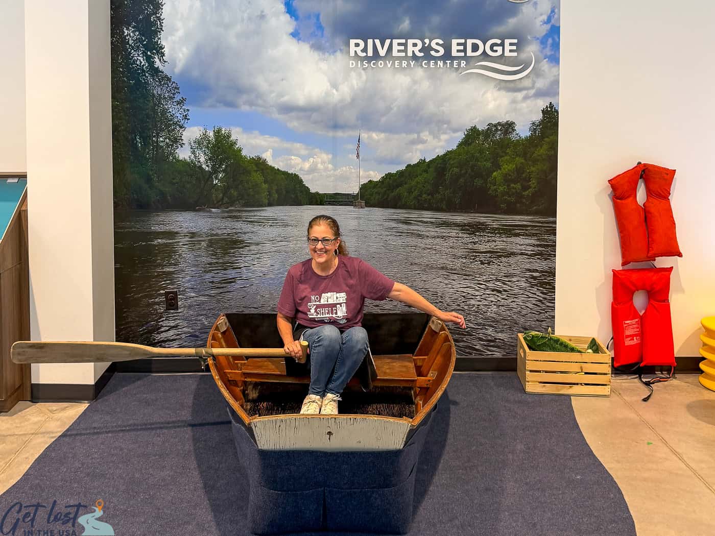 lady in canoe exhibit at River's Edge.