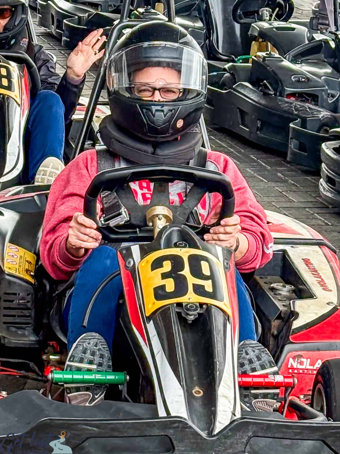 lady sitting in go kart.