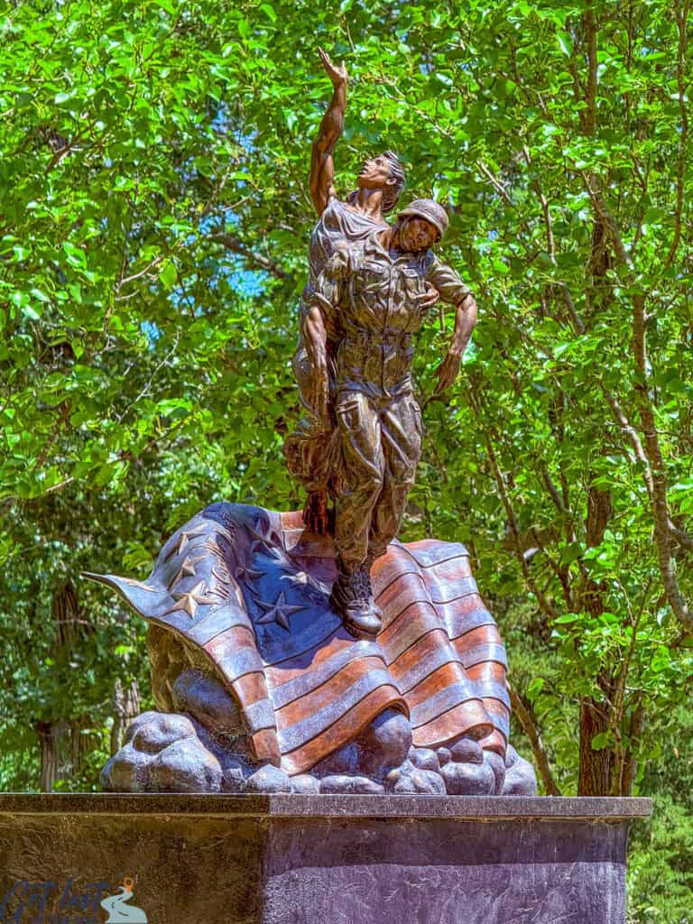 sculpture of soldiers with American flag.