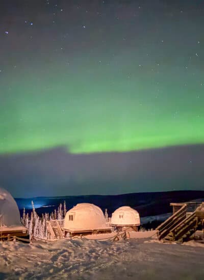Borealis Basecamp northern lights over igloos.