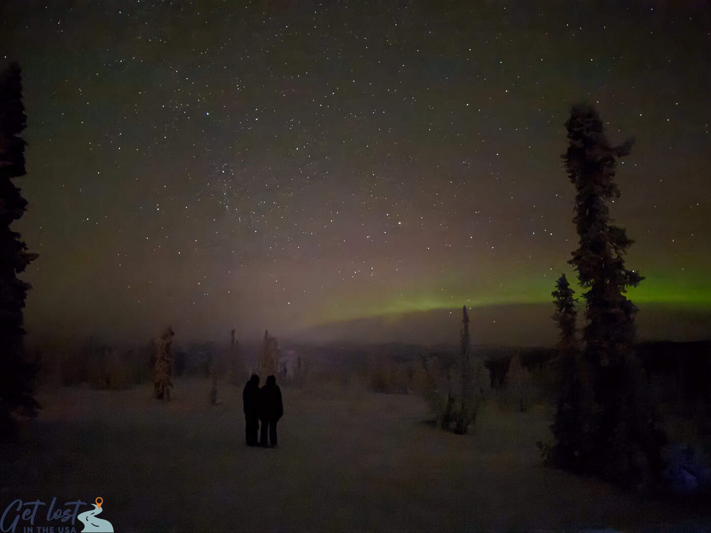 aurora on horizon Chena Hot Springs Resort Northern Lights Tour.