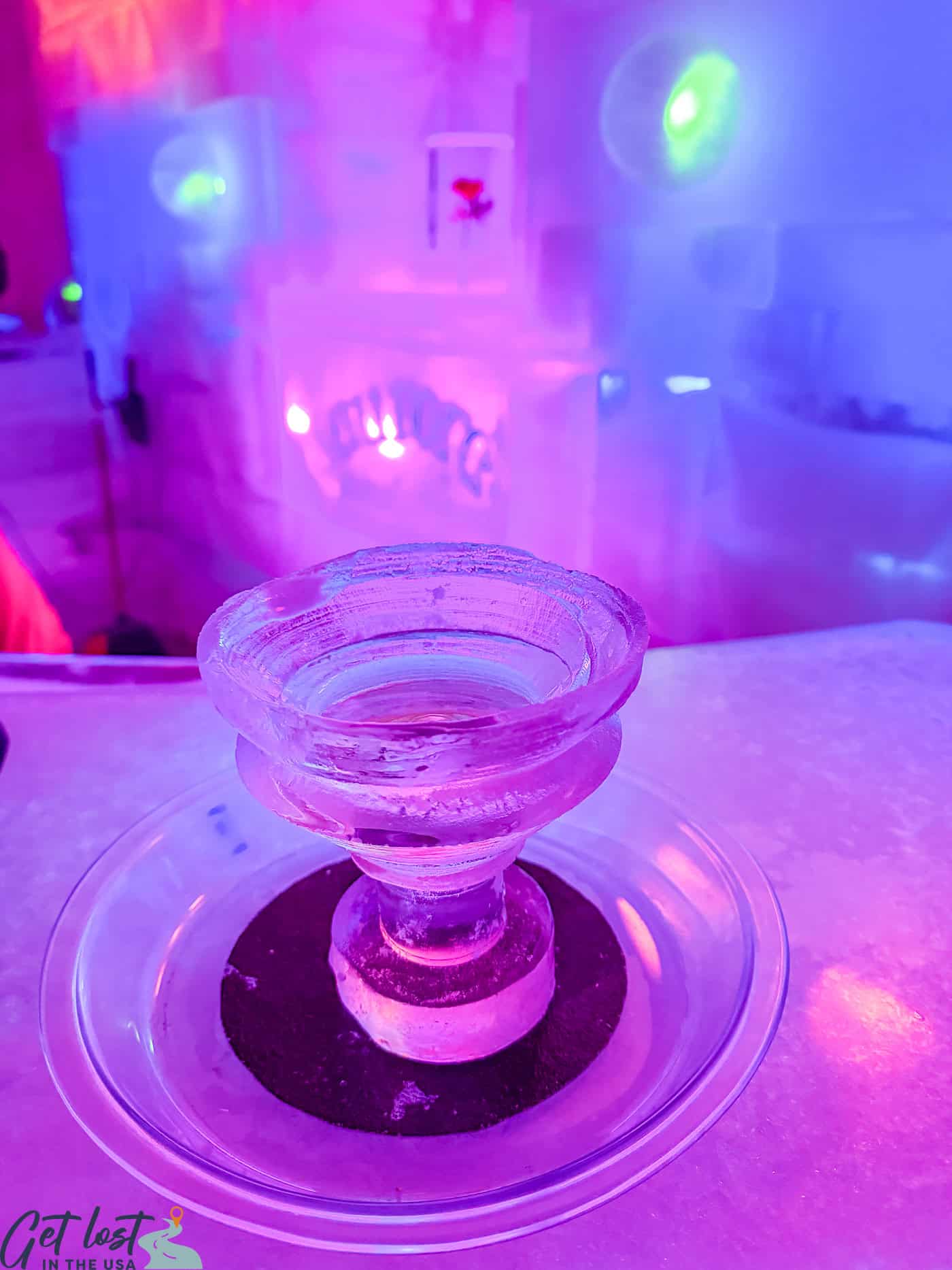 green appletini in ice glass.