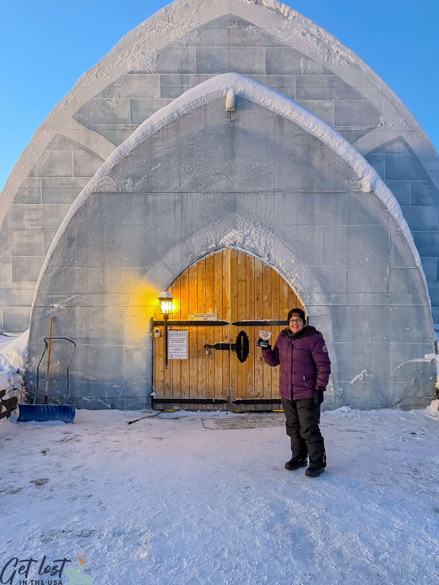 lady standing outside Chena Hot Springs Resort Ice Museum.