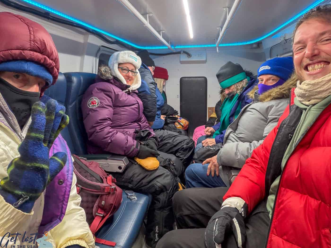 people inside snow coach - Chena Hot Springs Resort.