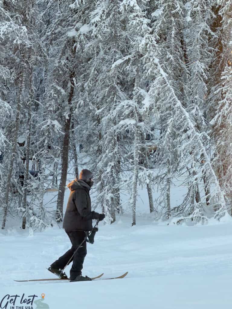 person snowshoeing at Aurora Borealis Basecamp.