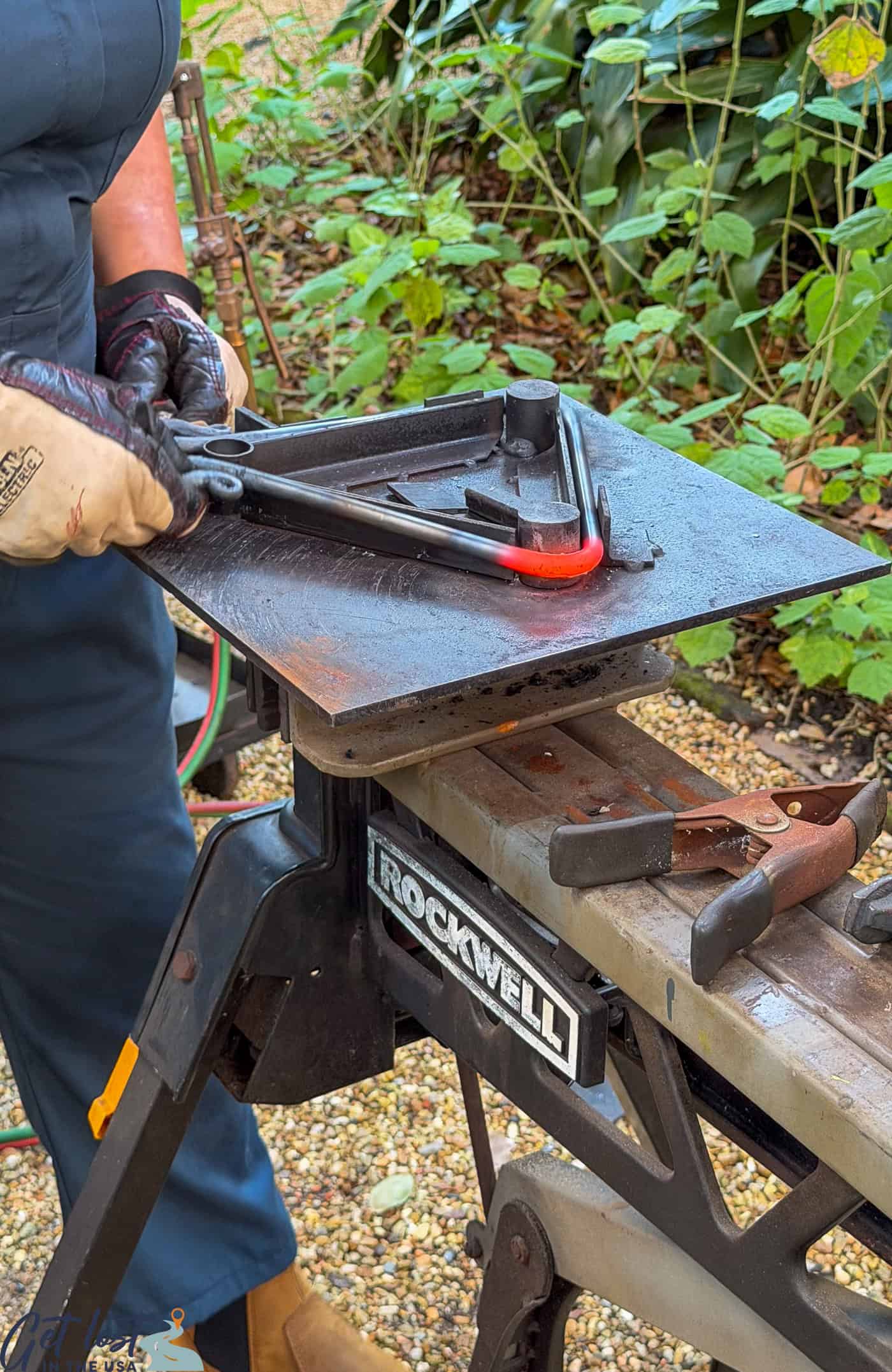 bending the hot t'fer around triangle mold.
