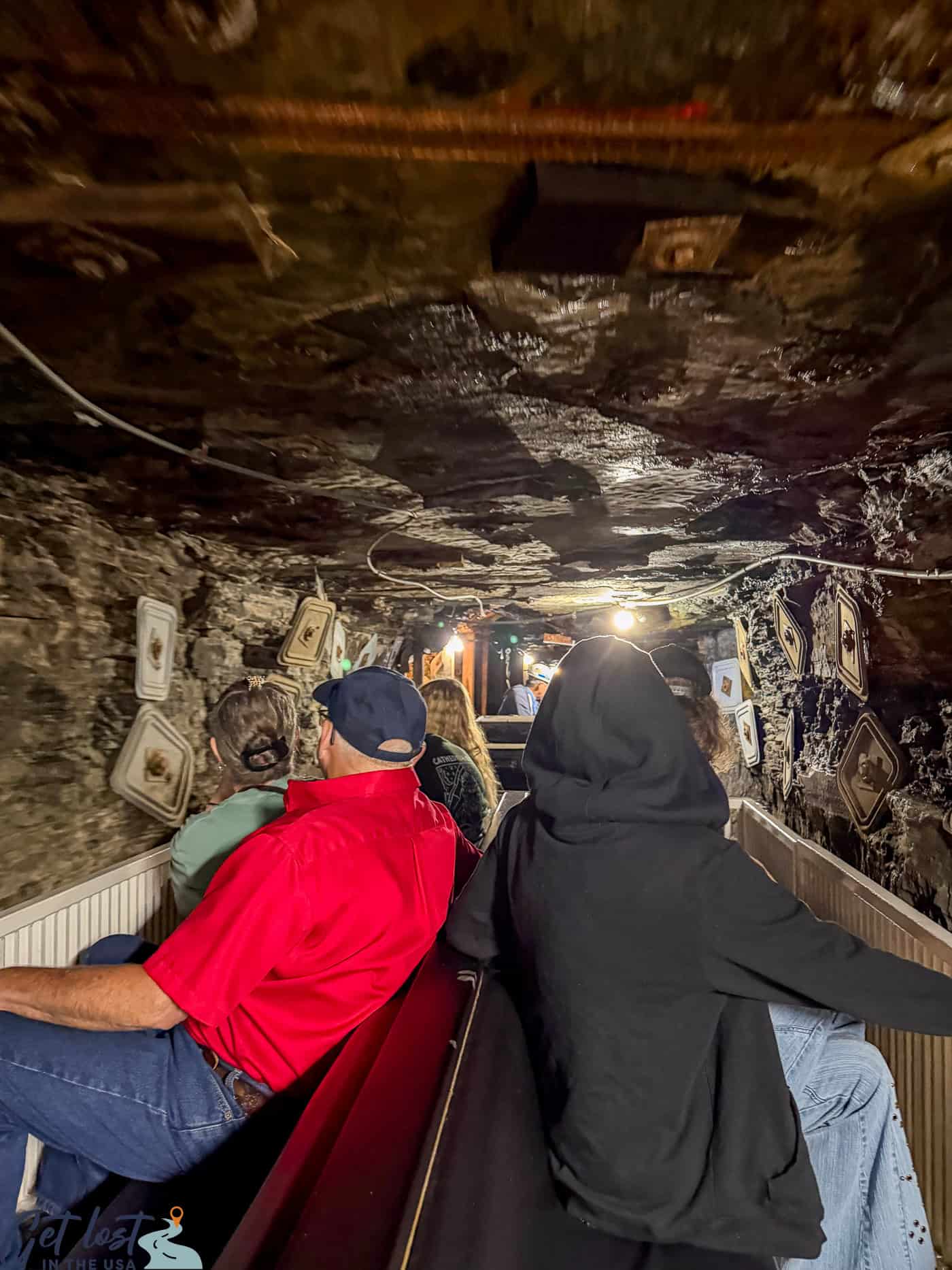 people riding into coal mine.