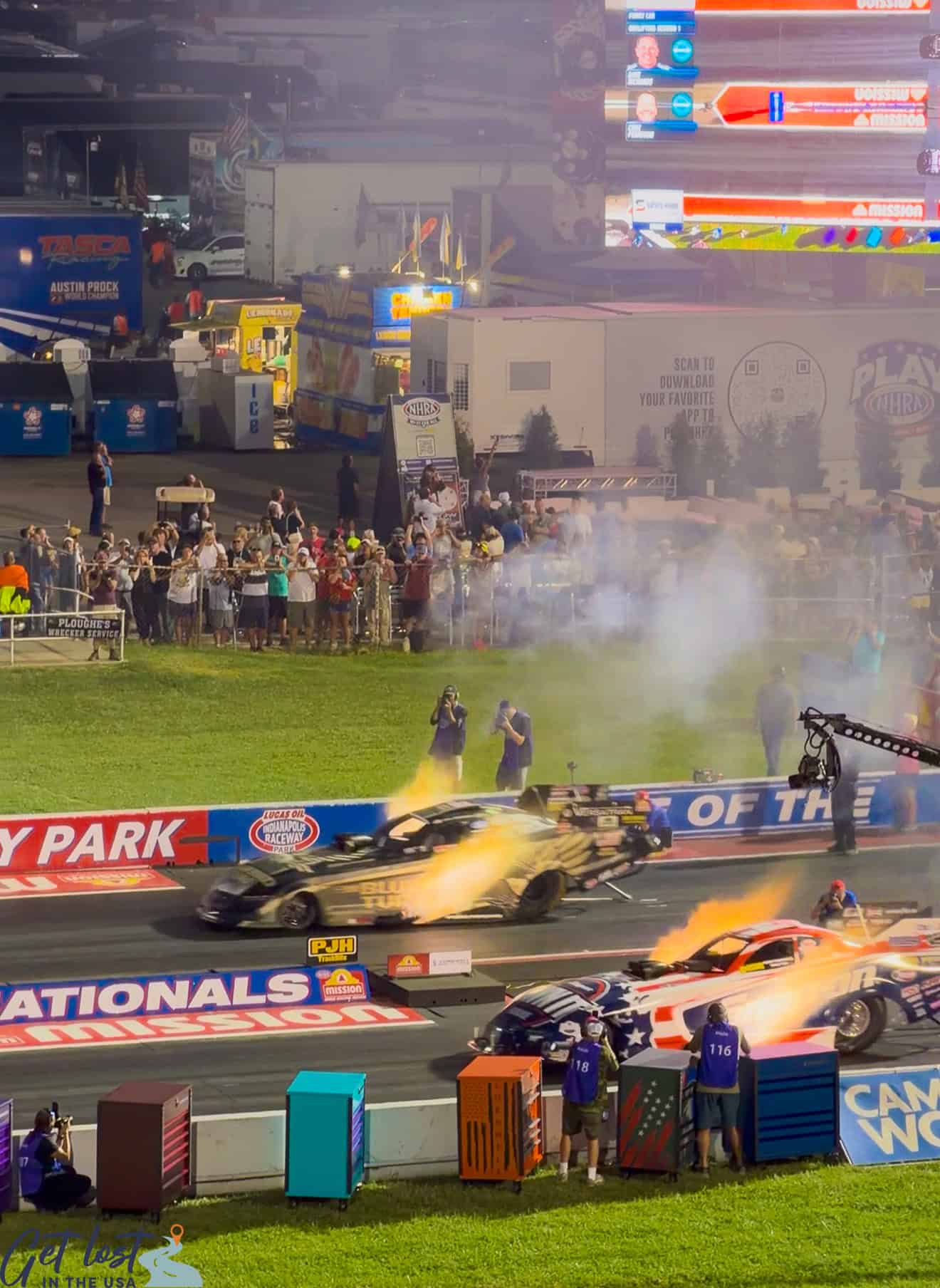 header flames from funny cars starting qualifying heat at NHRA Nationals.