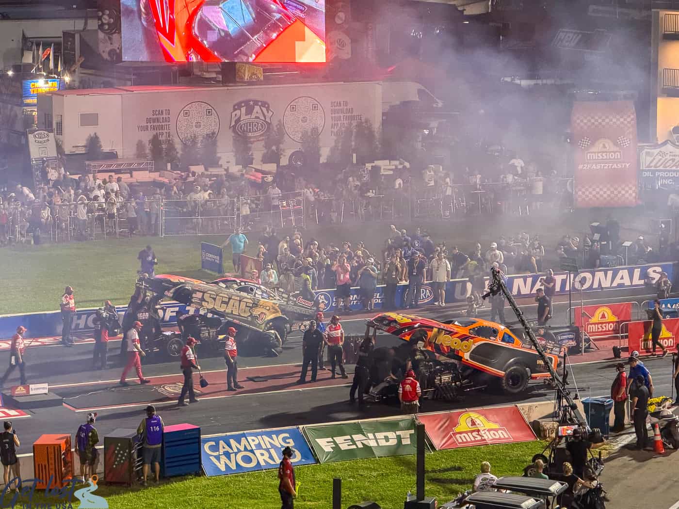 funny cars with tops up at NHRA Finals.