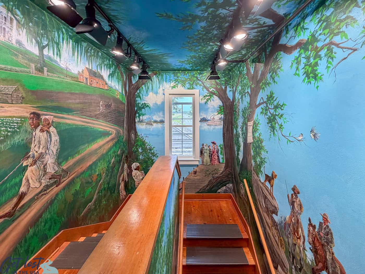 mural by staircase of Milton House Museum.